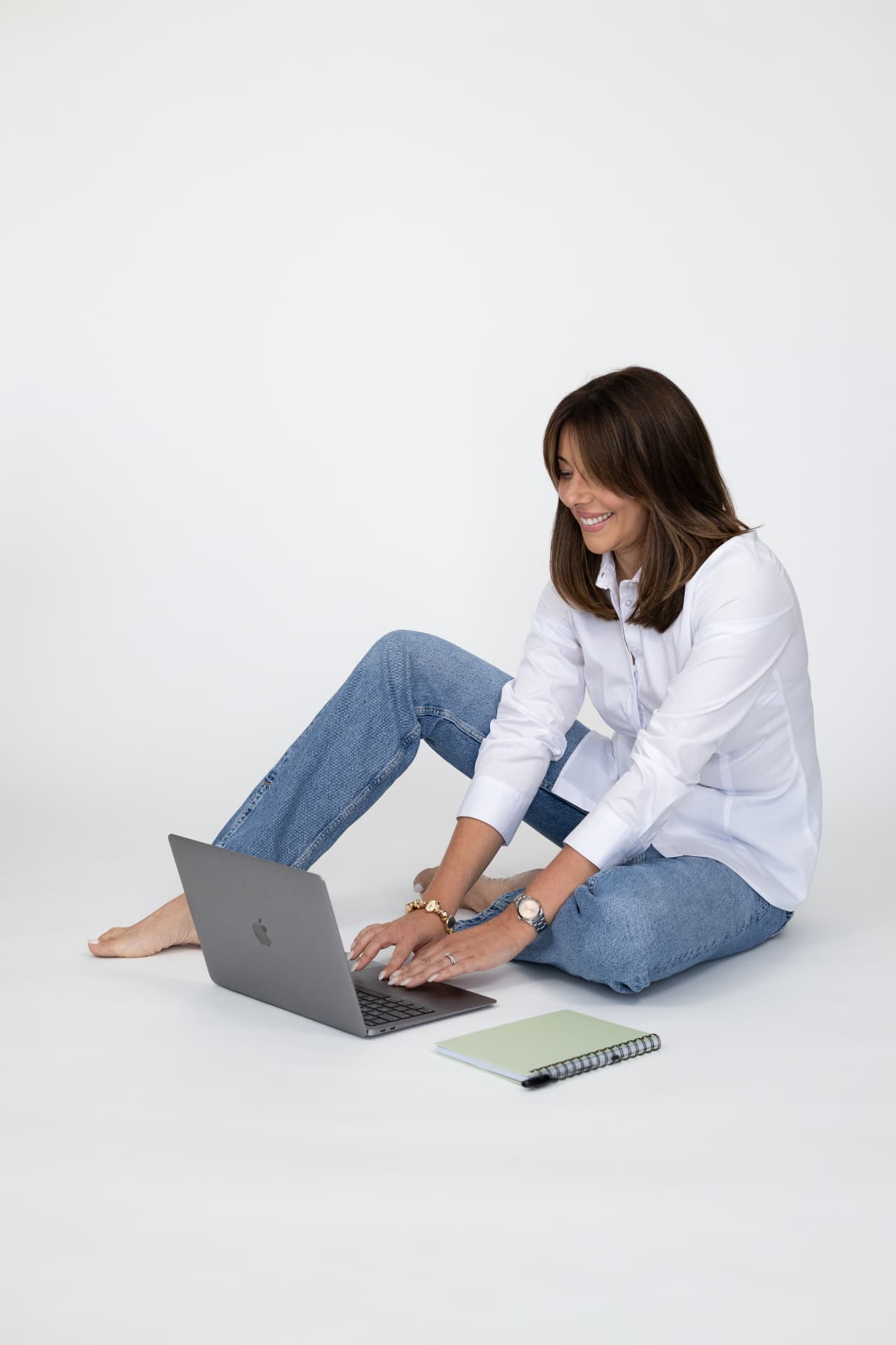 Chloe Sawyer working on a laptop