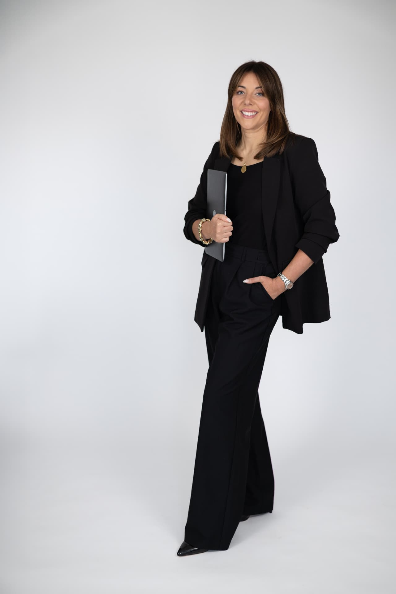 Chloe Sawyer, founder of The Click Method, holding a laptop
